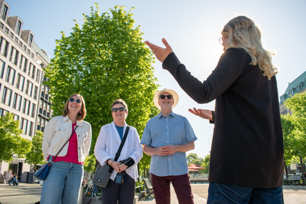 Highlights of Berlin Guests on a private tour of Berlin with the Unter den Linden in the background